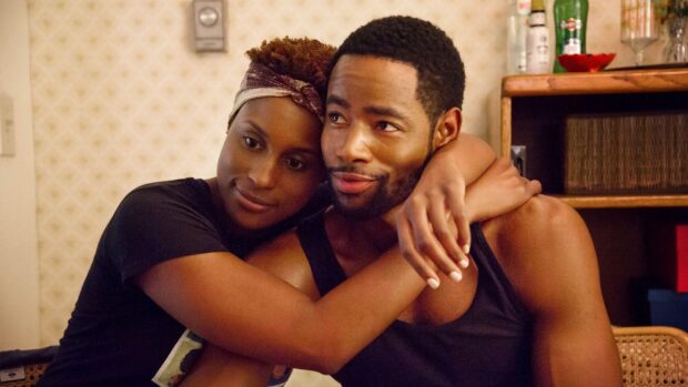 A tender moment showing a couple embracing in a cozy scene from Insecure Tv Series Wallpapers, HD Desktop Wallpaper