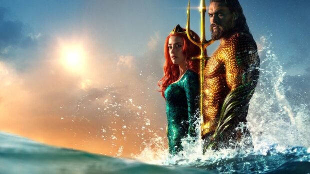 The Warner Bros Wallpapers feature Aquaman and Mera standing in the ocean with a sunset sky behind them, HD Desktop Wallpaper