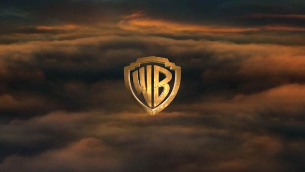The Warner Bros logo shines above golden clouds during sunset, 4K Desktop Wallpaper