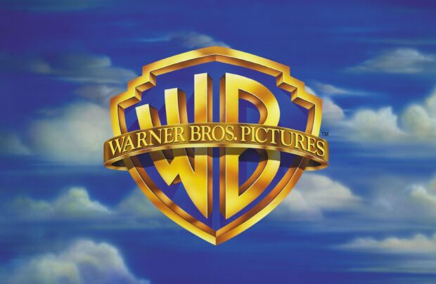 The Warner Bros logo is displayed against a cloudy blue sky with Warner Bros Wallpapers text, 2K Desktop Wallpaper