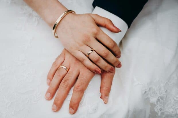 The wedding rings symbolize unity as the couple holds hands peacefull, HD Desktop Wallpaper