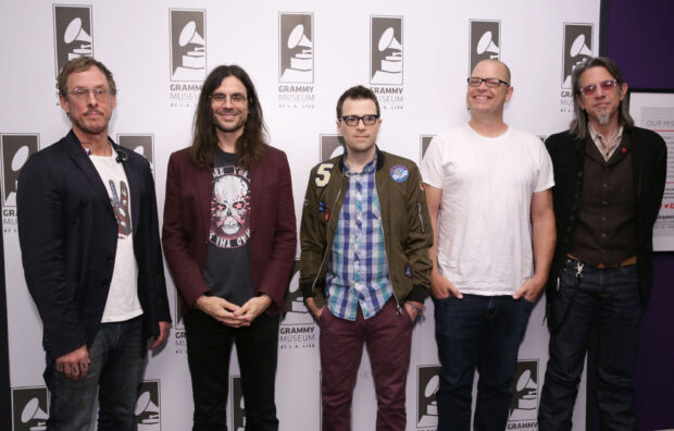 A photo featuring the band Weezer standing together at the Grammy Museum event, 2K Desktop Wallpaper