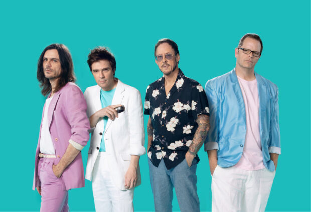 The Weezer band members pose against a turquoise background, 2K Desktop Wallpaper
