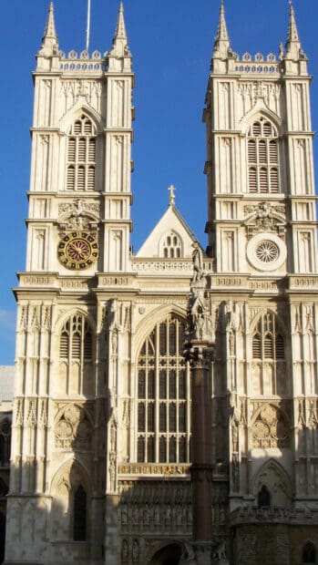 The Westminster Abbey historic architecture stands tall against a clear blue sky, HD Mobile Wallpaper