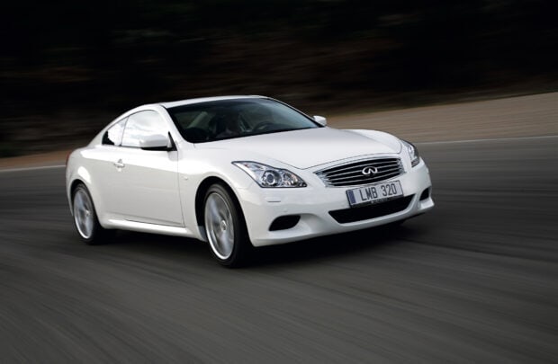 A white Infiniti G37 is shown driving swiftly along a curved road, HD Desktop Wallpaper