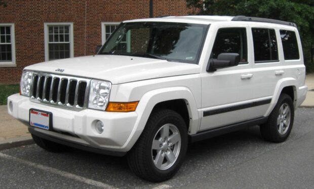A white Jeep Commander parked on the street near a building with windows, HD Desktop Wallpaper