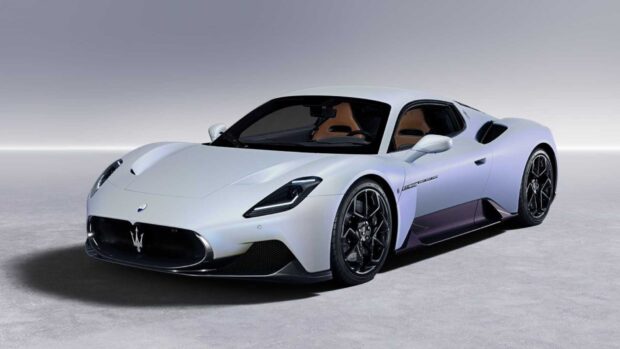 A white Maserati MC20 sports car is shown in a studio setting with black wheels and brown interior, HD Desktop Wallpaper