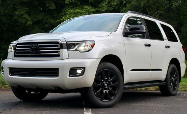 A white Toyota Sequoia is parked outdoors near trees, HD Desktop Wallpaper