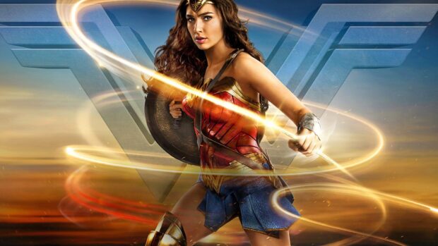 Wonder Woman movie character holding her shield and glowing lasso in an epic battle scene, HD Desktop Wallpaper