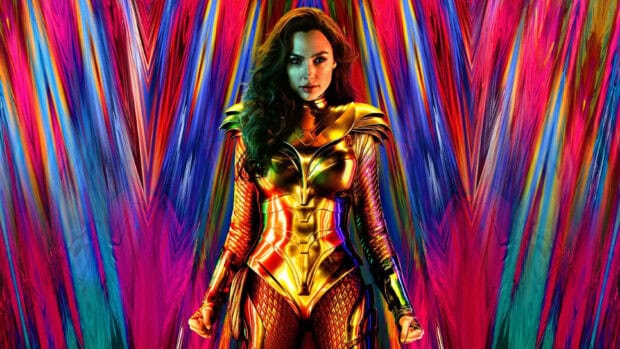 Wonder Woman stands confidently wearing golden armor with a vibrant abstract background, 2K Desktop Wallpaper