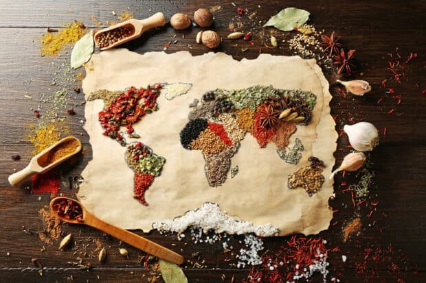 A world map created with different seasoning spices on parchment paper, 2K Desktop Wallpaper