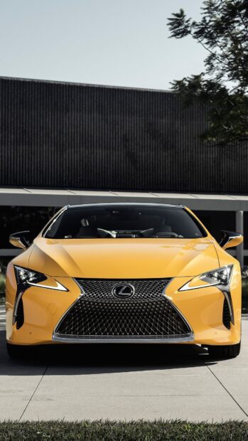 A yellow Lexus LC sports car is parked with a modern building background, HD Mobile Wallpaper