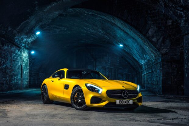 A yellow Mercedes Benz Amg GT is parked inside a dark tunnel with illuminated headlights, 2K Desktop Wallpaper