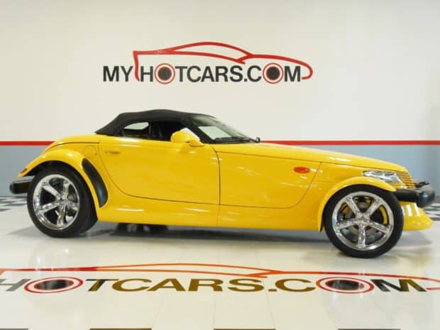A yellow Plymouth Prowler is shown from the side in a showroom, HD Desktop Wallpaper