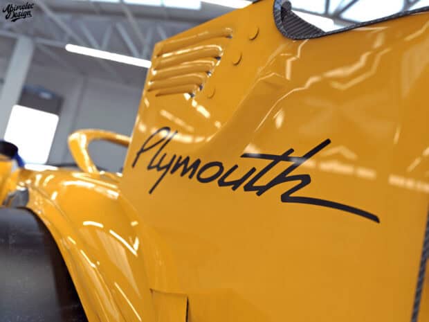 A detailed close up of a yellow Plymouth Prowler showing its body and logo, HD Desktop Wallpaper