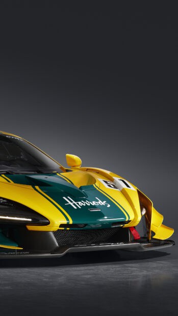 A yellow and green McLaren Senna sports car is parked in a studio setting, 4K Mobile Wallpaper
