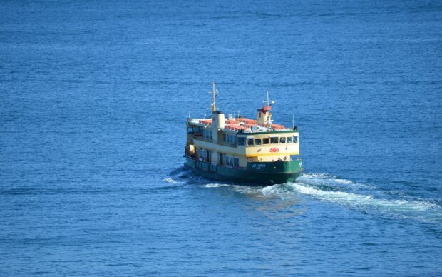 A yellow ferry sails smoothly on the calm blue sea, HD Desktop Wallpaper