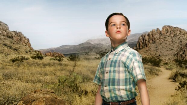 A young boy from Young Sheldon tv series stands confidently in a desert scene, HD Desktop Wallpaper