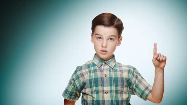 A young boy from Young Sheldon tv series points upward with a serious expression, HD Desktop Wallpaper