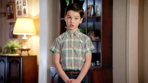 A young boy from Young Sheldon tv series stands indoors wearing a checkered shirt, HD Desktop Wallpaper