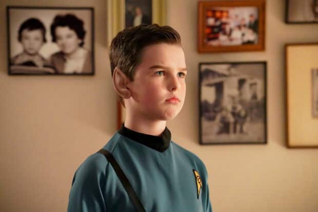 A young boy dressed as a Star Trek character with pointed ears in a room with framed photos, HD Desktop Wallpaper