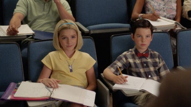 A scene from Young Sheldon Tv Series showing two children taking notes in class, HD Desktop Wallpaper