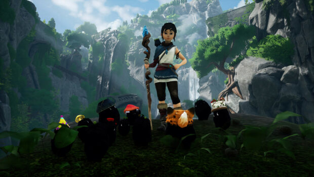 A young hero stands with spirit creatures in a forest clearing with cliffs, 4K Desktop Wallpaper