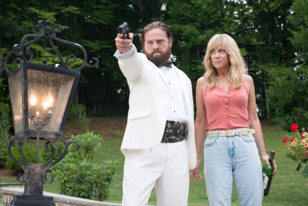 Zach Galifianakis wearing a white suit points a gun while a woman in casual clothes stands beside him outside, 2K Desktop Wallpaper