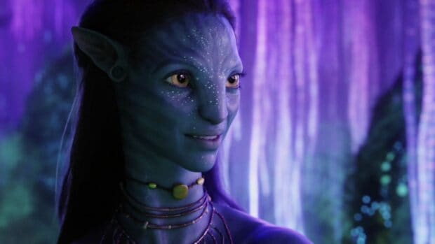 Zoe Saldana as Neytiri character in blue skin with glowing forest background, HD Desktop Wallpaper
