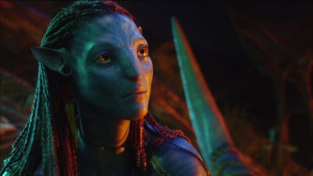 Zoe Saldana as Neytiri from Avatar is shown looking thoughtfully in a dark environment, HD Desktop Wallpaper
