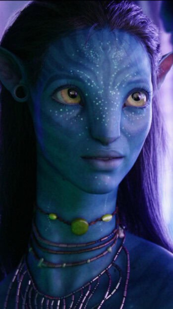 A close up of Zoe Saldana avatar character with glowing facial dots and detailed necklaces, HD Phone Wallpaper