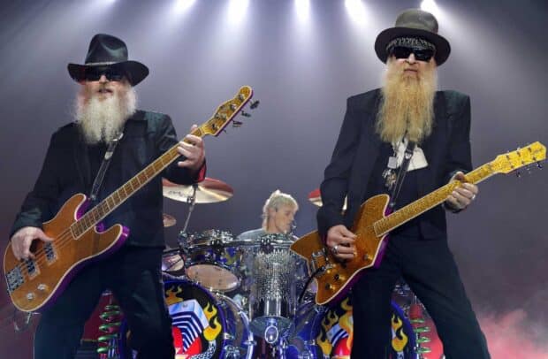 Two musicians from Zz Top band play guitars with drummer behind, HD Desktop Wallpaper