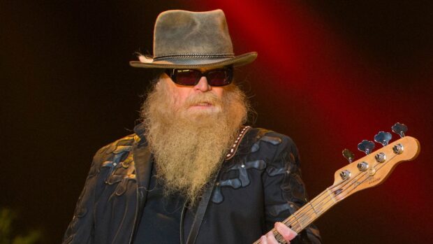 A Zz Top musician is playing electric guitar with a long beard and hat on stage, HD Desktop Wallpaper