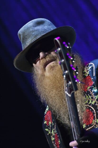 A close up of a Zz Top musician playing guitar wearing sunglasses and a floral jacket, HD Mobile Wallpaper