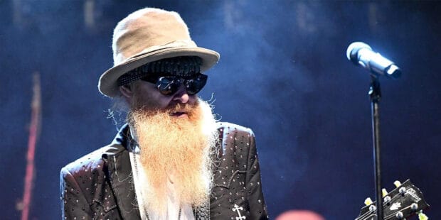 A musician from Zz Top wearing a hat and sunglasses during a live performance, HD Desktop Wallpaper