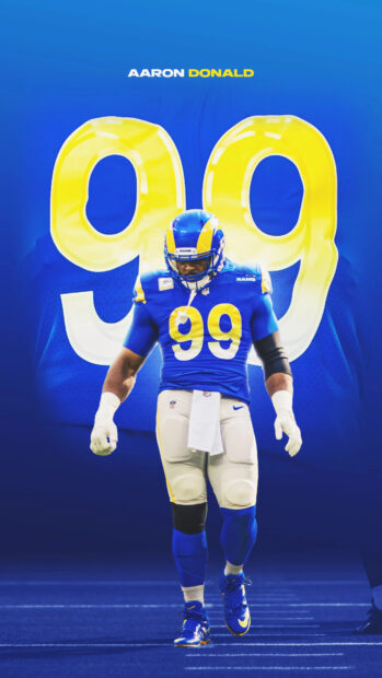 Aaron Donald stands focused on the field wearing Los Angeles Rams gear with number 99, 4K Phone Wallpaper