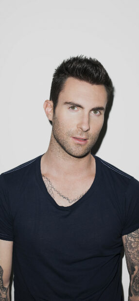 A portrait of Adam Levine showing his tattoos and intense gaze, HD Phone Wallpaper