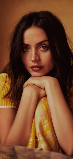 Ana De Armas shows a captivating expression while resting her chin on her hands, HD Phone Wallpaper