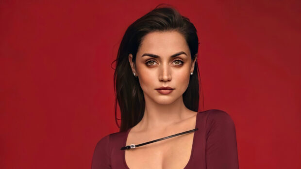 Ana De Armas poses confidently against a red background in this high quality image, 2K Desktop Wallpaper