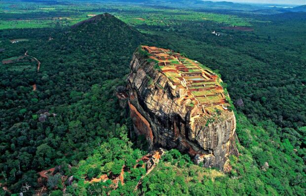 A lush green landscape surrounds the ancient rock fortress in Sri Lanka, HD Desktop Wallpaper
