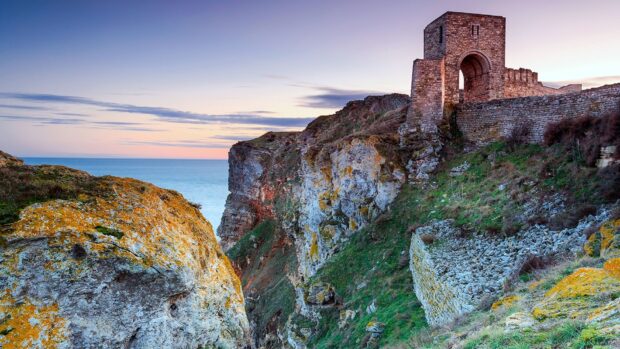 An ancient fortress stands on rocky cliffs overlooking the sea in Bulgaria, HD Desktop Wallpaper