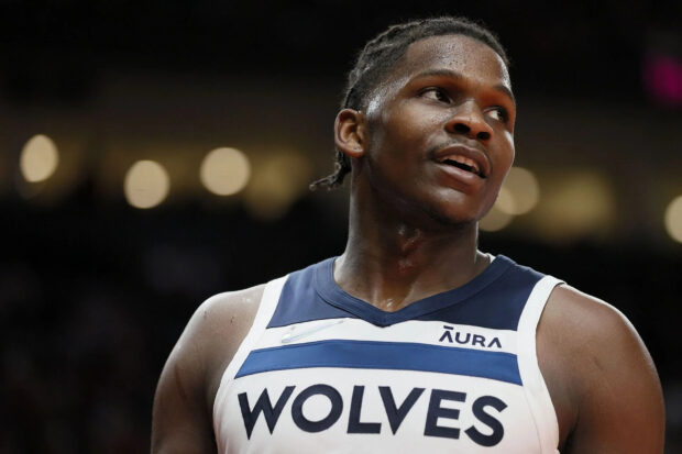 Anthony Edwards looking focused during a basketball game in Wolves jersey
