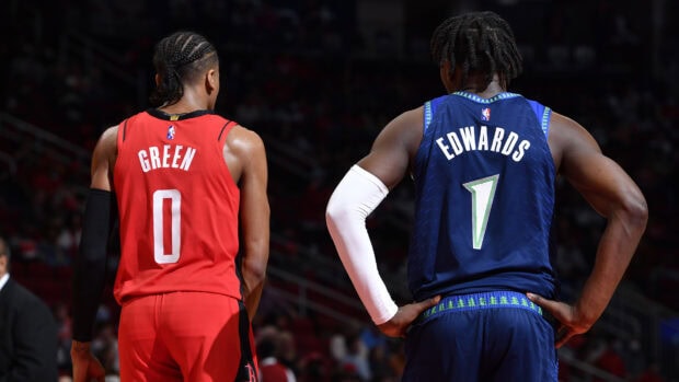 Anthony Edwards standing with basketball player Green during a game in a clear shot of the back of his jersey