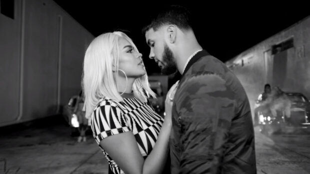 A black and white image of Anuel Aa sharing a close moment with a woman, HD Desktop Wallpaper