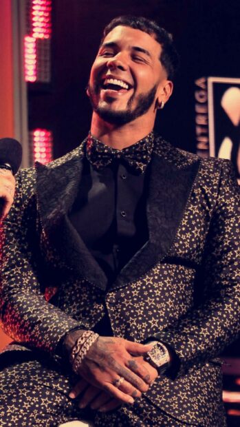 Anuel Aa wearing a star patterned suit while laughing joyfully, HD Phone Wallpaper