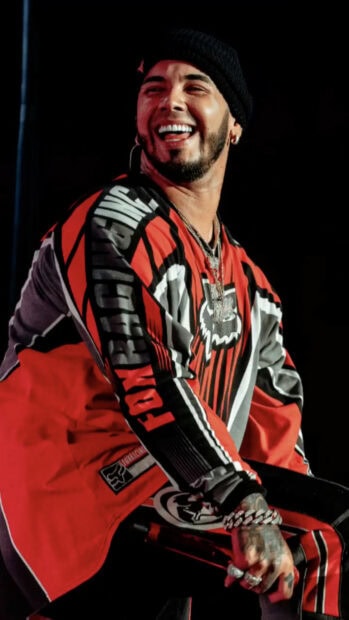 Anuel Aa is smiling during an energetic live performance, HD Mobile Wallpaper