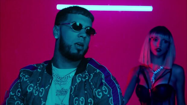 Anuel Aa is wearing sunglasses and chains in a neon lit scene with a female artist, HD Wallpaper