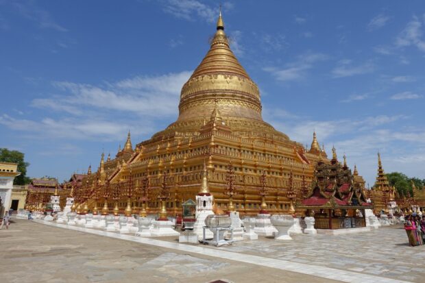 The golden pagoda of Bagan stands majestically under a clear blue sky