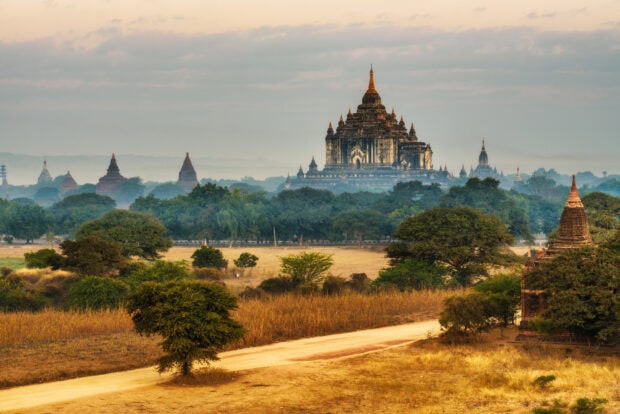 Ancient Bagan landscape with temple ruins and misty background in Myanmar