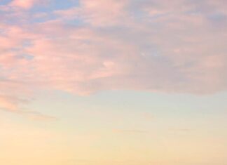 Baltimore skyline with boats and high rise buildings at sunset in HD quality